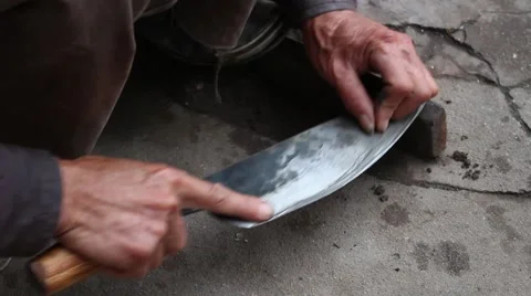 Farmer working knife sharpener Stock Footage 46458276