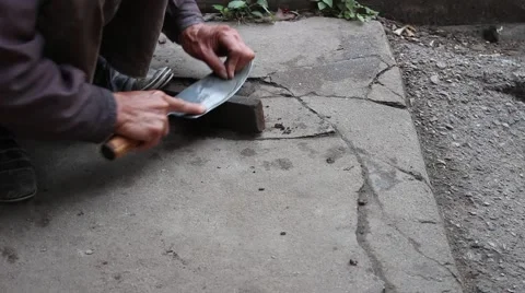 Farmer working knife sharpener Stock Footage 46459074