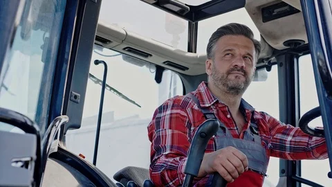 Farmer working on a modern tractor Stock Footage 114170460