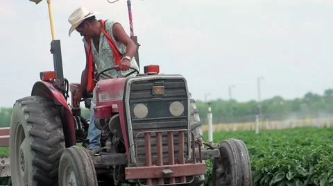 Farmer Working On Tractor In Crops Stock Footage 51936207