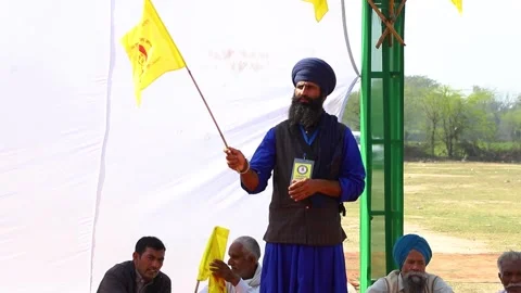 A farmer with yellow flag,they  are protesting against new farm law. Stock Footage 150650736