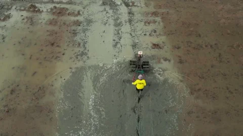 Farmers cultivate rice fields using machines Video stock 266113610