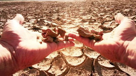 Farmer's hands split piece of dry soil from field affected by drought. Slow-mo 스톡 동영상 50058856