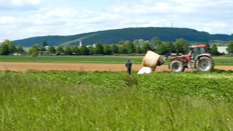 Farmers working on a field Видео 108007699