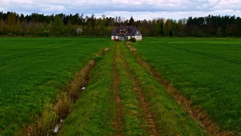 Farmhouse at the end of a dirt path Stock Footage 333312661