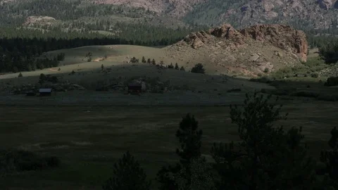 Farmhouse in field in shadow of cloud Lake George CO Stock Footage 85216983