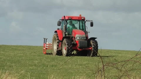 Farming agriculture tractor farmer red skyline Stock Footage 48334973