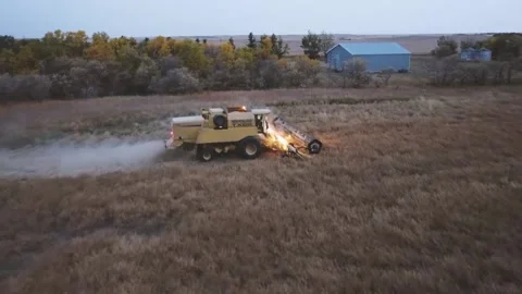 Farming Combine Driving Through a Field Stock-Footage 139791348