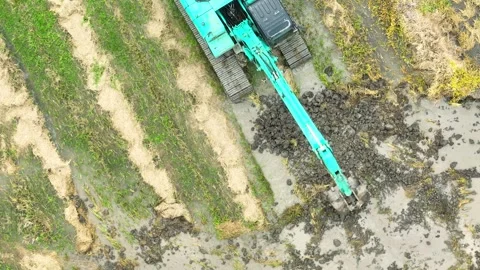 A farming machine actively working the rice field. Stock Footage 306838280