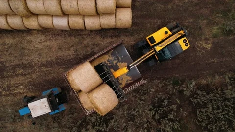 Farming machinery for loading hay stacks. Agricultural machinery. Farming Stock Footage 169764182