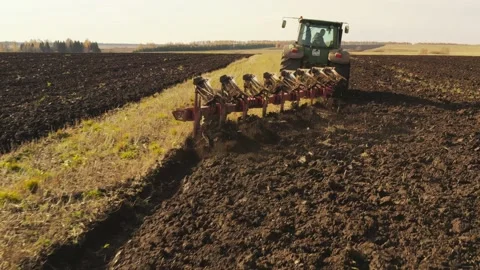 Farming machinery plows the field. Close-up. Stock Footage 148038816