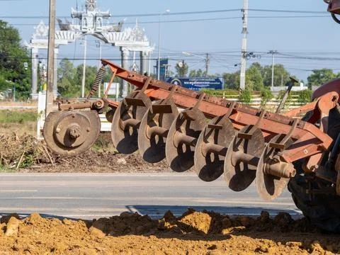 Farming practices close-up view of plowing machinery in rural agricultural .. Stock Photos