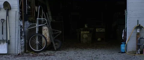 Farming tools and equipments kept at entrance of shed Stock Footage 69201702