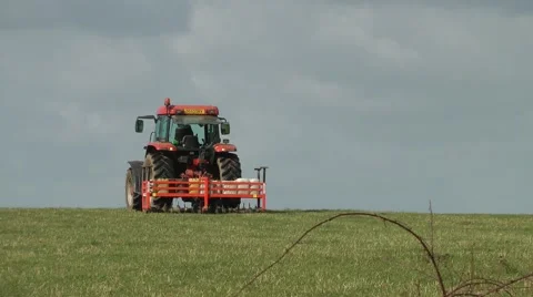 Farming tractor agriculture red field rural Stock Footage 48337208