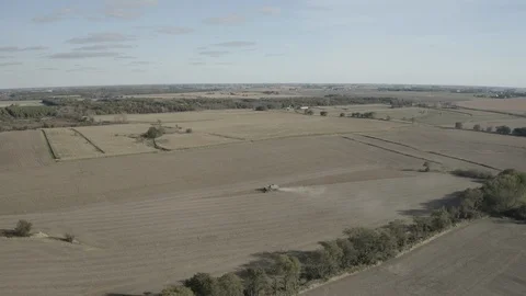 Farming - Tractor farming fields below with view of Landscape - 4K Aerial 動画素材 112320711