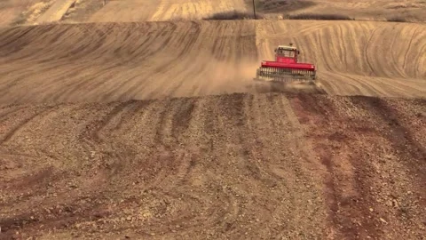 Farming Tractor Plowing and Seeding an Agricultural Field in Sichuan China Stock Footage 346423687