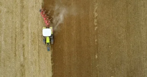 Farming - Tractor plowing field 4K Stock Footage
