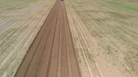 Farming tractor plowing on field. Video stock 127550599