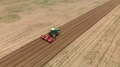 Farming tractor plowing on field. Video stock 127550654