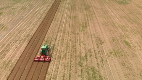 Farming tractor plowing on field. Video stock 127550854