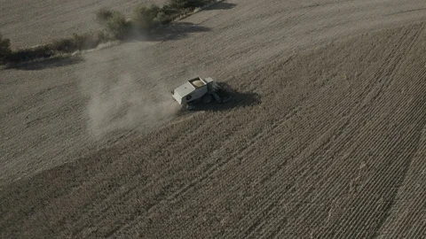 Farming - Zoom and Push on Tractor in Field while Harvesting - 4K Aerial 動画素材 112322429