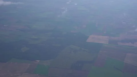 Farmland patchwork seen from the airplane window Video stock 165046992