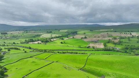 Farms and Fields over Bainbridge Village, Leyburn, North Yorkshire, England Stock-Footage 277304576