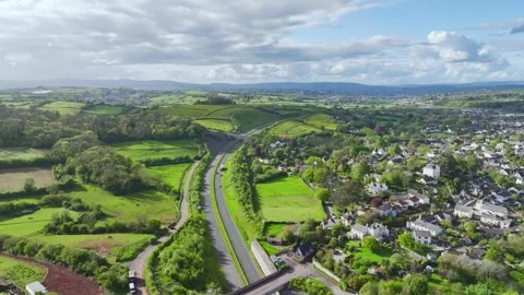 Farms and Fields over Kingskerswell and Road A380 from a drone, Devon, England Stock Footage 274765896