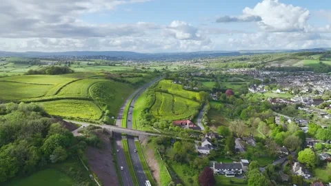 Farms and Fields over Kingskerswell and Road A380 from a drone, Devon, England Stock Footage 274765905