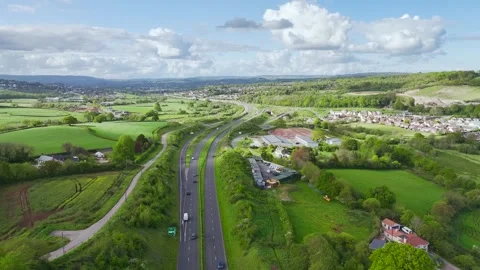 Farms and Fields over Kingskerswell and Road A380 from a drone, Devon, England Stock Footage 274765943