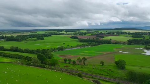 Farms and Fields over River Eden and River Eamont from a drone, Cumbria, England Vidéo 277858583