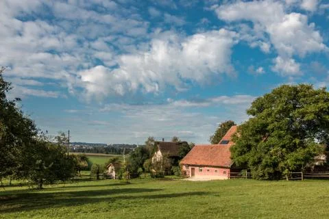 Farms, green fields, green meadows and trees Stock Photos