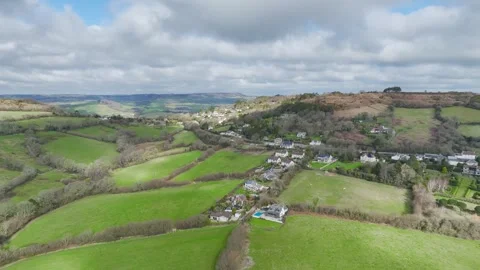 Farms over Road A35, Morcombelake Village, Bridport, Dorset, England Stock Footage 304819649