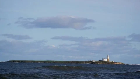 Farne Lighthouse Inner Farne with waves Stock Footage 256099106
