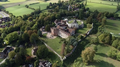 Farnham Castle in sunshine with guests mingling outside, drone aerial 4K Stock Footage 101199425