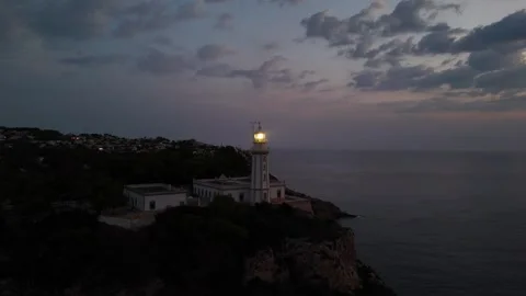 Faro de Cabo de la Nao lighthouse at twilight overlooking Mediterranean 動画素材 337139306
