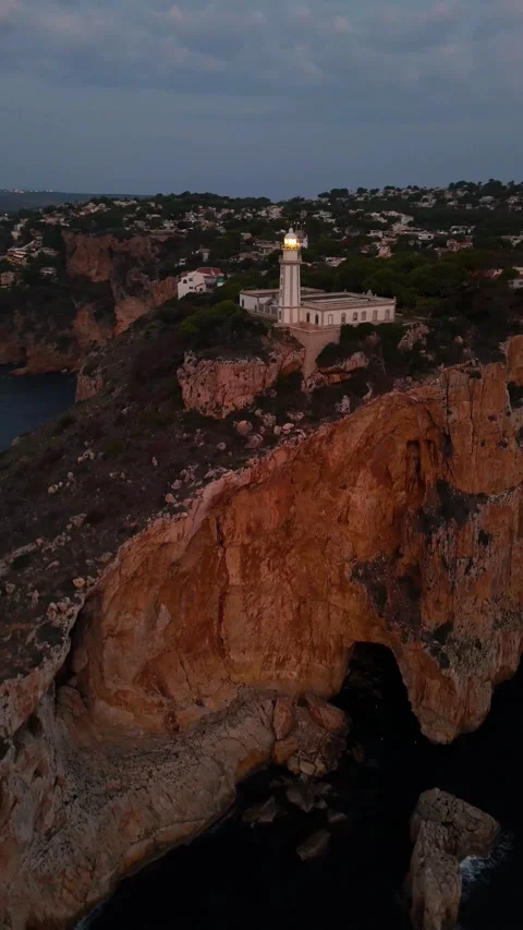 Faro de Cabo de la Nao illuminated beacon at dusk vertical format 動画素材 337312824