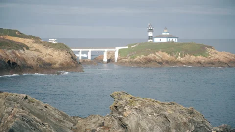Faro Isla Pancha, Ribadeo. Spain. Caravan, sea light house, bridge and sea. Video stock 169748436