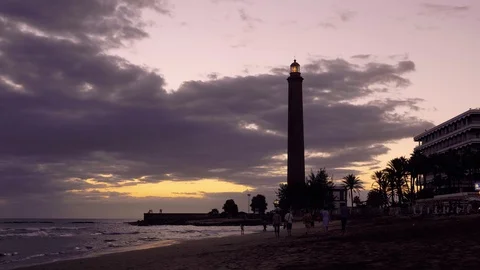Faro Maspalomas beach lighthouse at sunset, canary islands. Stock Footage 97468313
