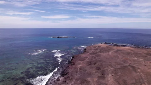 Faro Punta de Jandia Drone Flight Over Coastal Desert in Fuerteventura Stock Footage 309695360