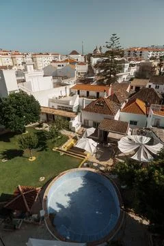 Faro rooftops with empty swimming pool and garden, Algarve, Portugal Stock Photos