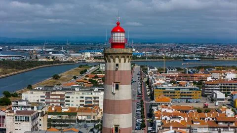 The Farol da Barra de Aveiro, or Aveiro Barra Lighthouse, is located in Ave.. Stock Photos