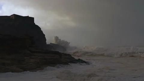 Farol da Nazaré - Lighthouse on the rock.Dramatic silhouette Stock Footage 230454988