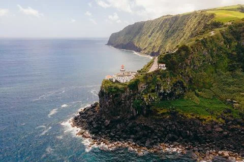 Farol do Arnel is a graceful lighthouse on Sao Miguel Island, Azores, guiding Stock Photos
