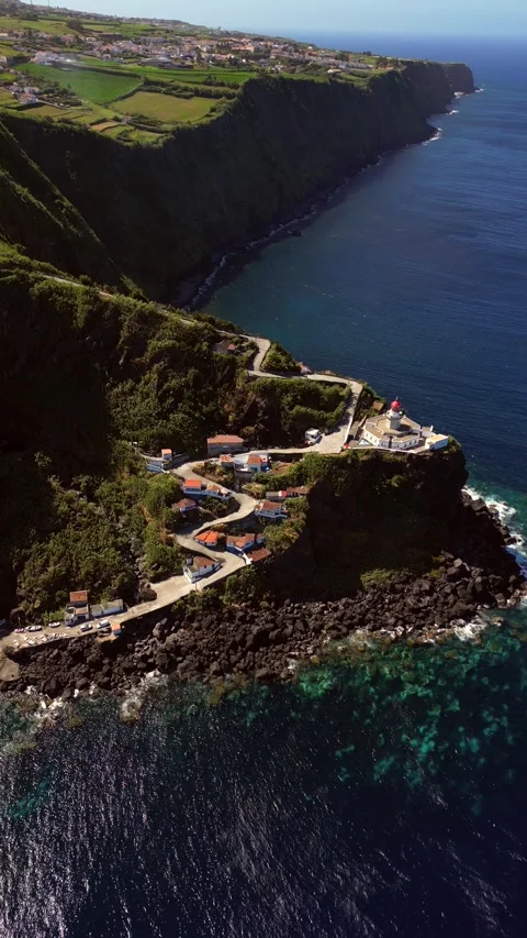 Farol do Arnel Light house Sao Miguel Azores Portugal drone Stock Footage 284723234