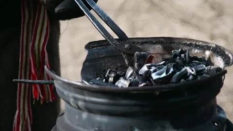 Farrier preparing coals in slow motion Stock Footage 77011077