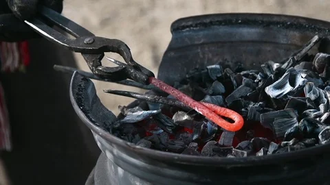 Farrier preparing coals in slow motion Stock Footage 77011200