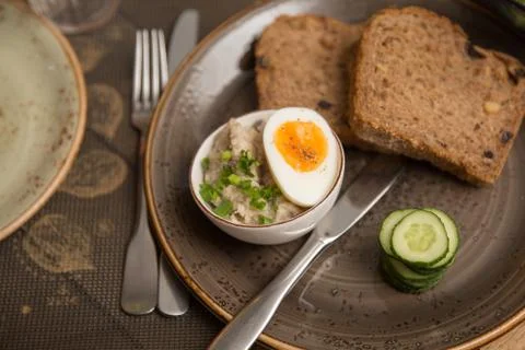 Farshmak with bread, cucumber and half cooked egg Stock Photos