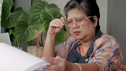 Farsightedness problem for the elderly concept, retirement woman with eyegl.. Stock-Footage 248069245