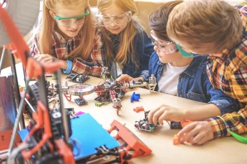 Fascinated schoolchildren in light workshop Stock Photos